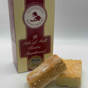 box of tobermory stores handmade rustic shortbread with two delicious pieces of tobermory stores rustic handmade shortbread in the foreground